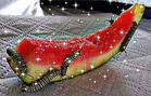 Catipillars eating a watermelon with sparkle overlay.